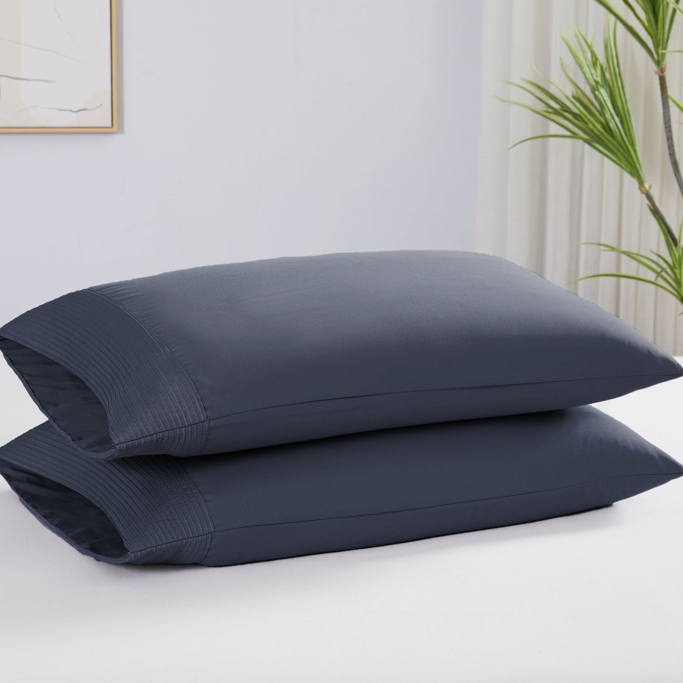 Two Vilano Pleated Pillow Cases in Dark Blue Stack Together#color_vilano-dark-blue