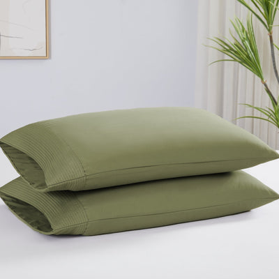 Two Vilano Pleated Pillow Cases in Sage Green Stack Together#color_vilano-sage-green