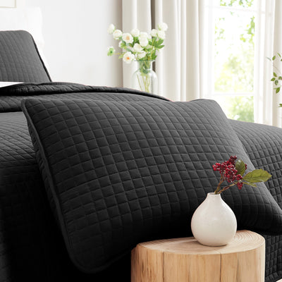 Close Up View of Vilano Quilted Shams in Black#color_vilano-black