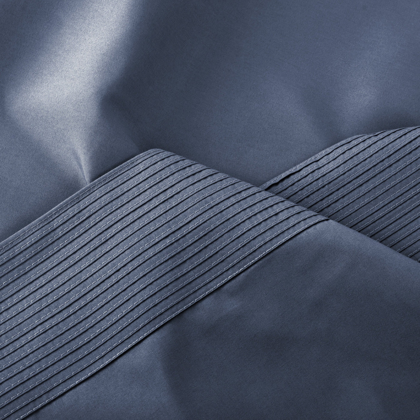 Details of Elegant Pleated Hem of Vilano in Dark Blue#color_vilano-dark-blue