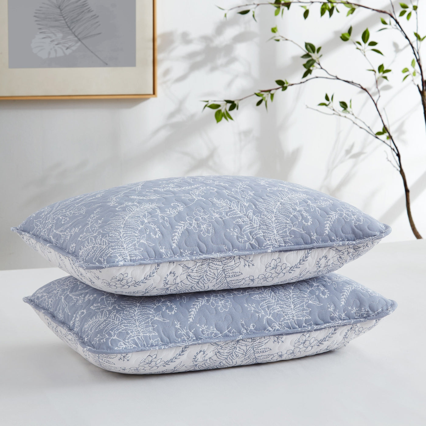 Two Winter Brush Quilted Shams in Blue Stack Together#color_winter-brush-blue