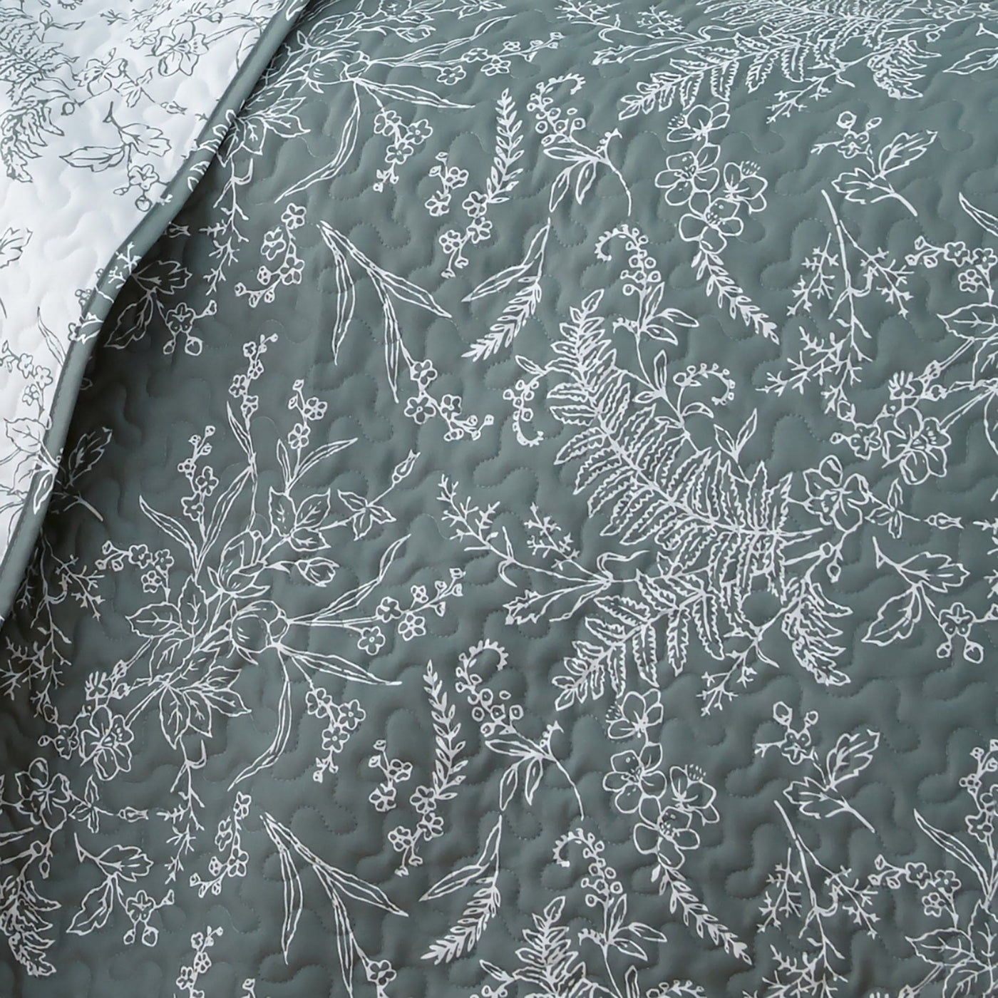 Details and Texture of Winter Brush Reversible Quilt Set in Teal#color_winter-brush-teal