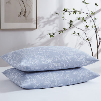 Two Winter Brush Pillowcases in Blue and White Flowers Stack Together#color_winter-brush-blue-with-white-flowers