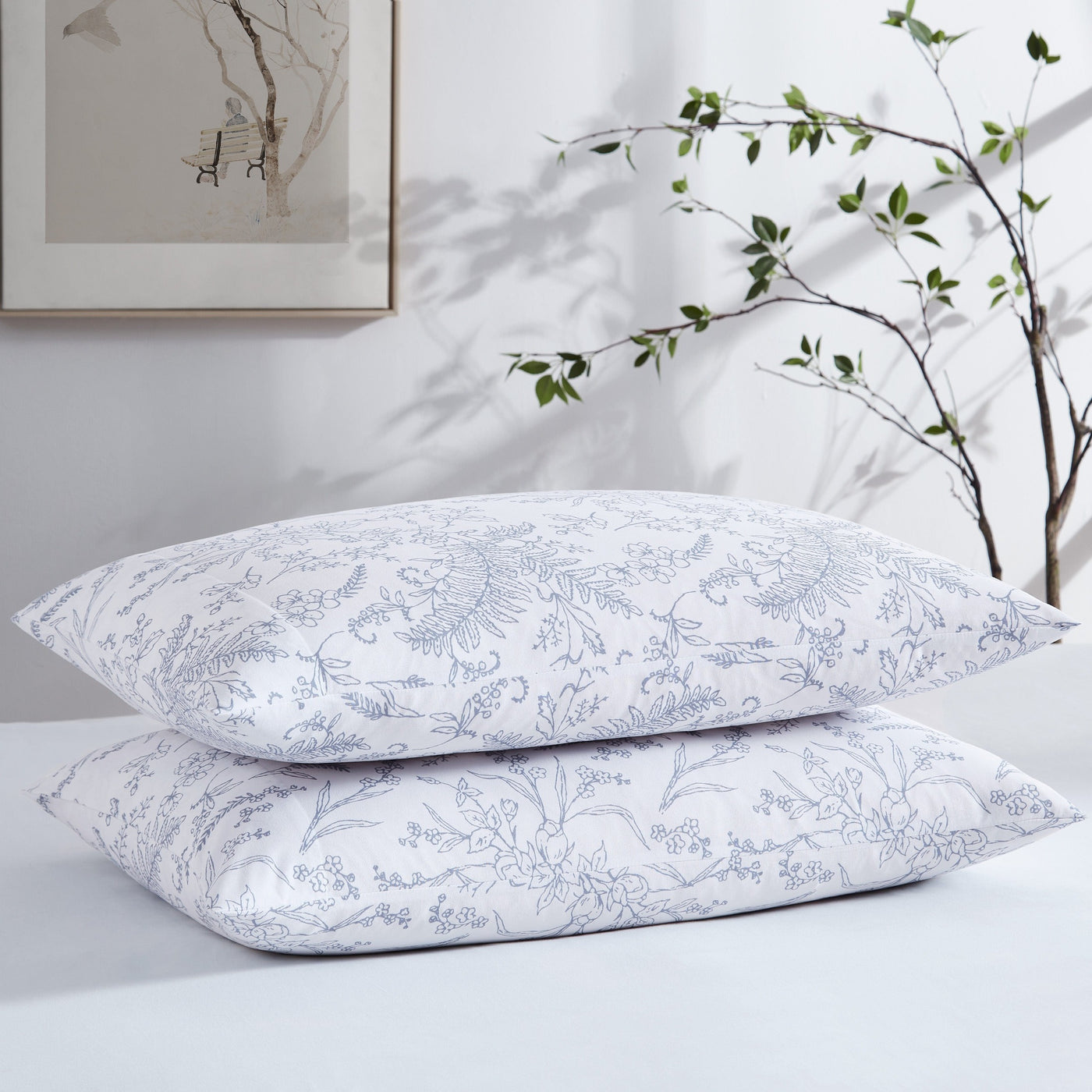 Two Winter Brush Pillowcases in White and Blue Flowers Stack Together#color_winter-brush-white-with-blue-flowers