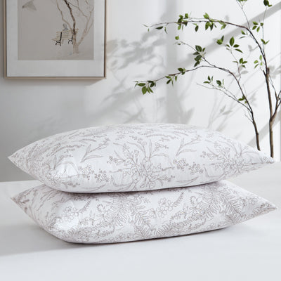 Two Winter Brush Pillowcases in White and Warm Sand Flowers Stack Together#color_winter-brush-white-with-warm-sand-flowers