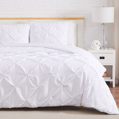 Half Front View of Pintuck Pinch Pleated Duvet Cover Set in White#color_vilano-bright-white